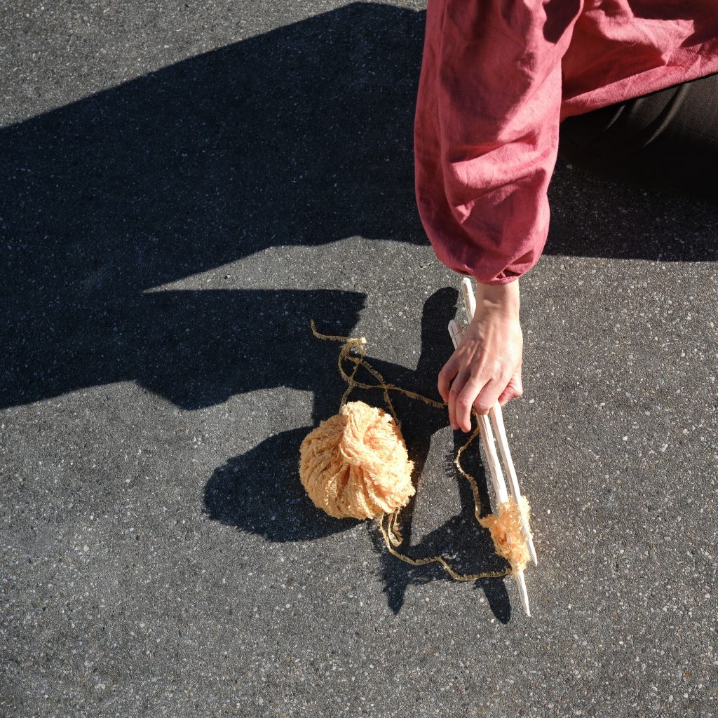 Wolle und Strícknadeln